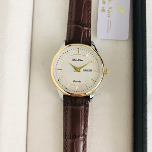 Women's quartz watch with brown leather strap and dual day-date calendar display