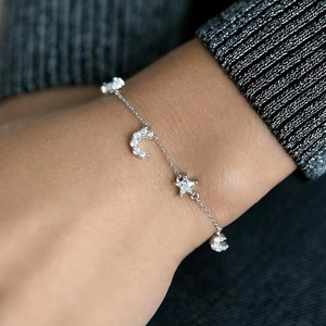 Elegant S925 sterling silver star and moon bracelet with sparkling cubic zirconia on wrist