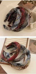 Detail of handmade plaid tweed headbands showing premium texture and internal label