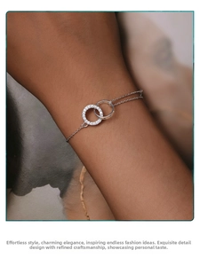 Detail of S925 sterling silver double-ring bracelet with pave-set zircon on the wrist