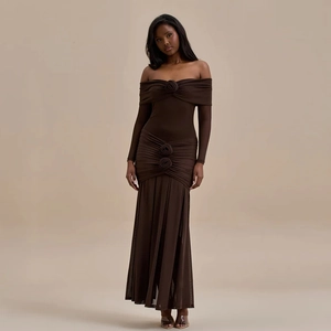 Detailed view of the dark brown strapless dress featuring 3D floral accents and elegant pleats