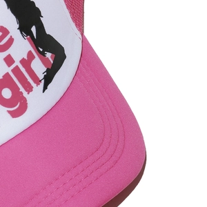 Detail of pink trucker hat showing high-quality curved stitching and graphic girl print