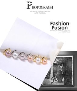 Macro detail of S925 silver triangle earrings with natural freshwater pearls in varied colors