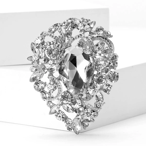 Close-up of vintage rhinestone brooch with water drop crystal and silver alloy floral design