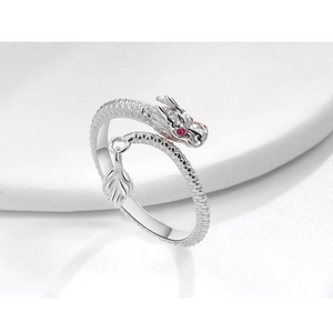 Detail showing scales and red gems on a silver dragon-shaped adjustable ring