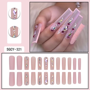 Pink glitter press-on nails with rhinestones and matte finish in 24-piece long coffin set