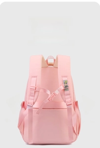Pink nylon backpack detail showing breathable mesh padding and adjustable chest strap