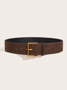 Detail of dark brown wide waist belt with golden square buckle and matte leather texture