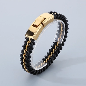 Detail view of black woven leather bracelet with gold stainless steel clasp and chain
