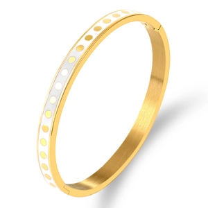 Gold plated stainless steel bangle featuring white enamel with polka dots and side hinge