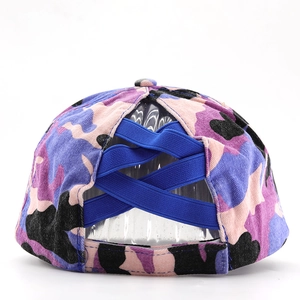 Detail of criss-cross elastic bands on camouflage ponytail baseball cap for high messy buns