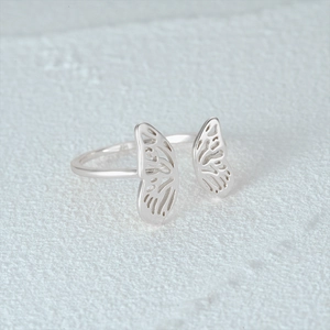 Macro shot of S925 sterling silver butterfly wing ring showing the inner certification mark