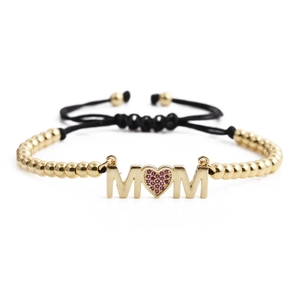 Gold beaded MOM bracelet with heart-shaped pink zircon and adjustable black cord strap
