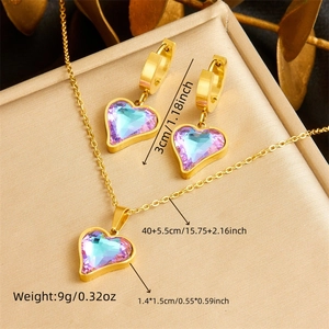 Parure de bijoux en acier doré avec pendentif cœur en cristal coloré et créoles