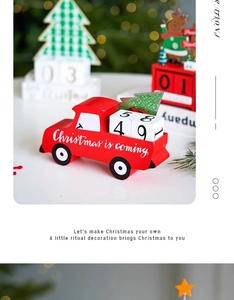 Close-up of wooden red truck advent calendar with wooden blocks and a mini tree