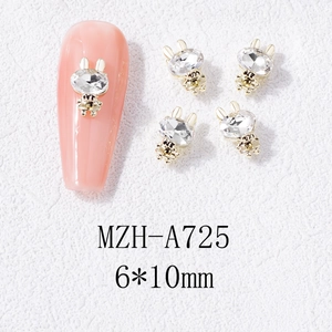 Détail de bijoux d'ongles lapin dorés 6x10mm avec cristal pour nail art festif et élégant