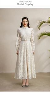 Detail view of white lace dress with stand collar, lantern sleeves and waist belt