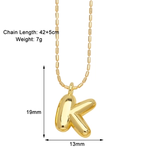 Detailed view of 3D gold-plated K letter pendant with dimensions 19x13mm and 47cm chain