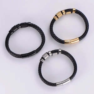 Three-piece set of woven leather bracelets with gold, silver, and black metal clasps