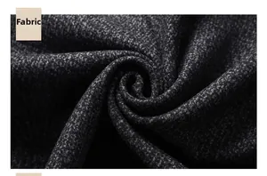 Macro shot of dark grey wool blend fabric showing thick textured weave and high quality