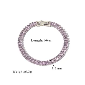Detail of 18K gold-plated clasp on a tennis bracelet with baguette-cut purple zircon