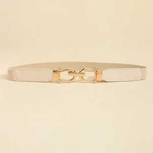 Close-up of beige elastic waist belt featuring a polished golden interlocking U-shaped buckle