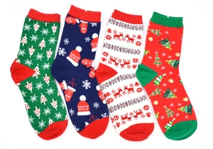 Close-up of four festive Christmas cotton socks with reindeer and tree patterns