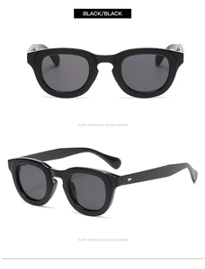 Detail view of bold black round frame retro sunglasses with sleek metal temple accents
