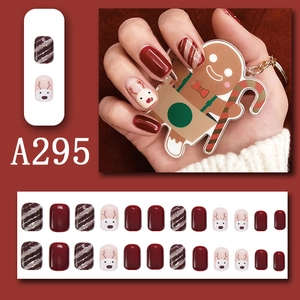 Short square press-on nails with Christmas reindeer patterns and red glitter design