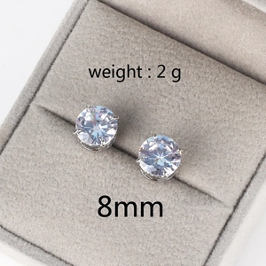 Detail of 8mm four-prong round zircon stud earring weighing 2g in a velvet jewelry box
