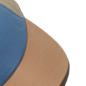 Detailed close-up showing the precise stitching on a breathable mesh baseball hat in color block