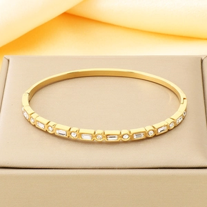 Macro detail of 18K gold plated stainless steel bracelet with square cubic zirconia
