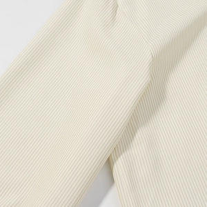Detailed macro view of cream striped fabric texture showing high-quality woven patterns