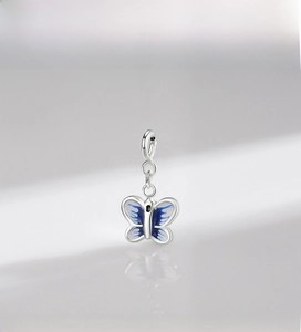 Detailed close-up of 925 sterling silver butterfly pendant with blue enamel finish