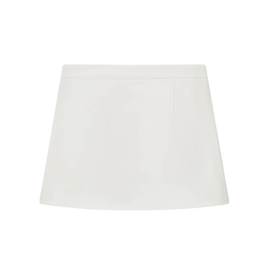 Detail view of a white A-line mini skirt featuring a simple stitched waist design