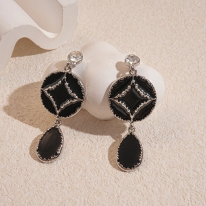 Retro black drop earrings with crystal studs and silver starburst relief detail