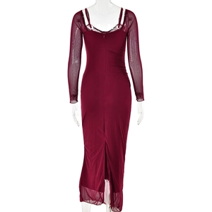 Macro shot of back detail with burgundy lace mesh patchwork and rear slit on the dress
