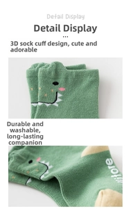 Detail display of green dinosaur kids sock with 3D cuff and fine knit texture