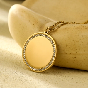 Elegant gold titanium steel necklace with a circular zircon-encrusted heart pendant design