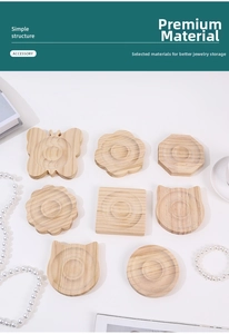 Close-up of assorted wooden jewelry display trays with unique nature-inspired shapes