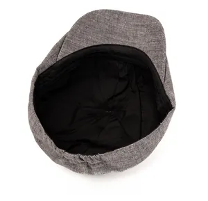 Detailed view of the vintage grey flat cap interior with lining and elastic adjustment
