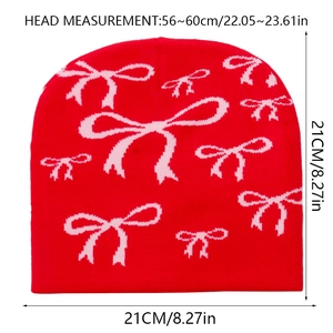 Detailed knit pattern of red beanie with pink bow jacquard and size measurements