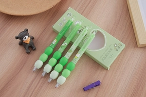Detail of four gradient green retractable gel pens with soft ergonomic bulbous grips