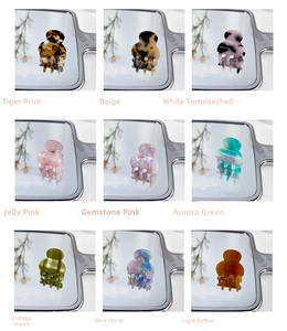 Detailed grid view of nine colorful mini acetate hair claws with trendy patterns