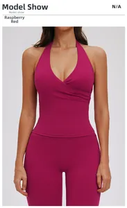 Front view of model wearing a V-neck halter yoga top and high-waist pants in raspberry red