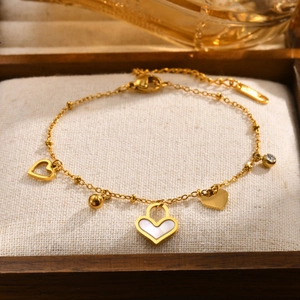 Golden stainless steel heart charm bracelet with shell inlay and sparkling zircon stone