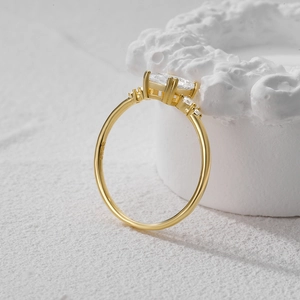 Close-up of S925 sterling silver gold ring featuring oval gemstone and claw setting