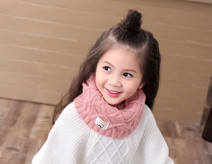 Pink knitted winter neck warmer for kids featuring a cute mustache pattern label