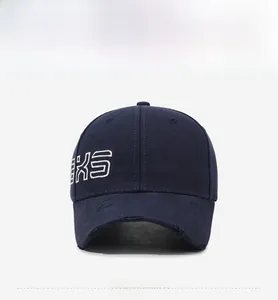 Detail of navy cotton twill baseball cap showing white letter embroidery and distressed brim