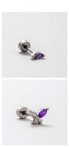 Macro shot of silver titanium steel earrings with purple marquise zircon butterfly design